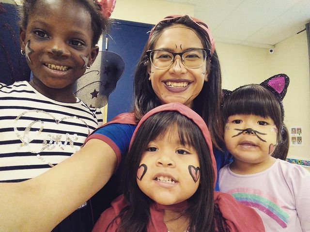 Ile Coco educator with three children at our NDG (Somerled) bilingual daycare
